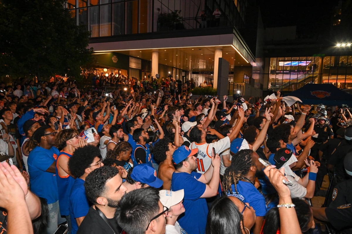  Jun 13, 2026; New York, New York, USA; New York Knicks fans celebrate outside of Madison Square Garden on Plaza 33 following Game 5 of the NBA Finals between the New York Knicks and the San Antonio Spurs. Mandatory Credit: Brenden Willsch-Imagn Images 