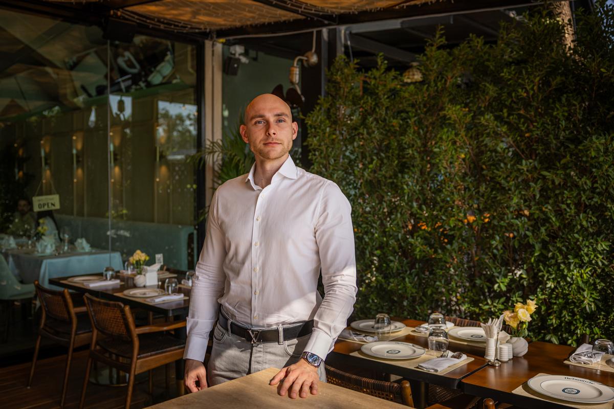 Maksim Shatilov at his restraint in Phuket, Thailand, where he also owns a real estate brokerage that serves Russian families, on March 8, 2026. Russian buyers accounted for more than half of property sales in Phuket in the first year of the war in Ukraine, according to a government research agency. "After the war started, there weren't many places where you could feel free to be a Russian," Shatilov said. (Lauren DeCicca/The New York Times)..