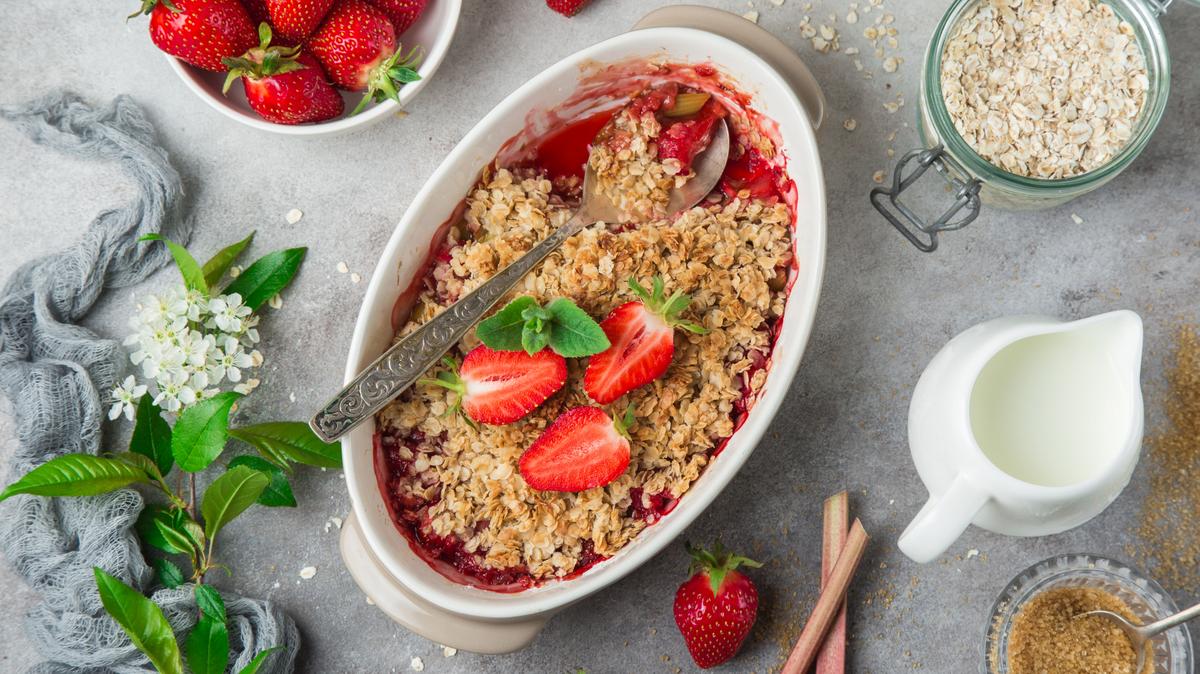 healthy vegan rhubarb and strawberry oats crumble pie for breakfast, top view
