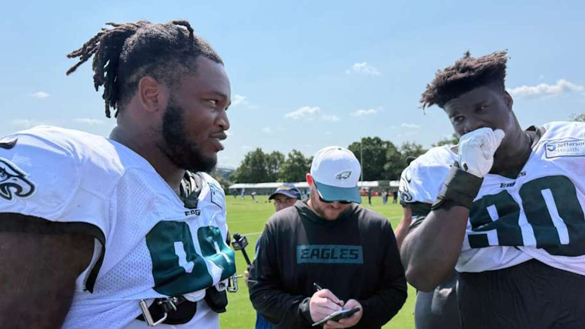  Eagles defensive linemen Jalen Carter and Jordan Davis get ready for post-practice interviews during training camp. | Ed Kracz/Eagles on SI 
