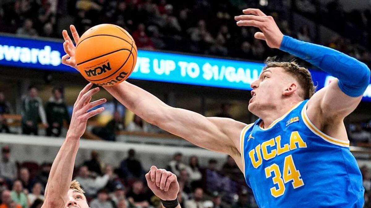  Michigan State center Carson Cooper (15) and UCLA forward Tyler Bilodeau (34) battle for the rebound during the first half of Big Ten tournament quarterfinal at United Center in Chicago on Friday, March 13, 2026. | Junfu Han / USA TODAY NETWORK via Imagn Images 