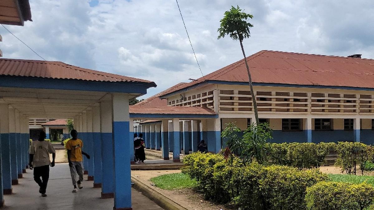 People walk at Bunia General Referral Hospital following confirmation of an Ebola outbreak involving the Bundibugyo strain in Bunia, Ituri province, Democratic Republic of Congo, May 16, 2026. REUTERS/Victoire Mukenge