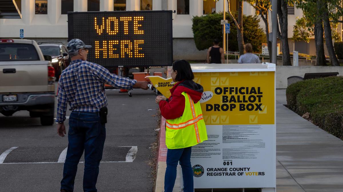 An election worker watches a voter place his ballot in the drop box at the Orange County Registrar of Voters in Santa Ana, California, on  Nov. 5, 2024. (Allen J. Schaben/Los Angeles Times/TNS)