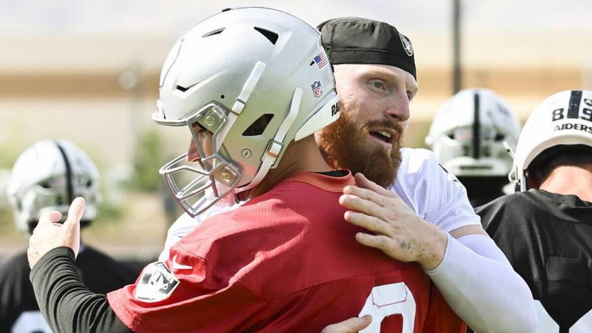  Jun 3, 2026; Henderson, NV, USA; Las Vegas Raiders defensive end Maxx Crosby (98) hugs quarterback Kirk Cousins (8) during organized team activities at Intermountain Health Performance Center. Mandatory Credit: Candice Ward-Imagn Images | Candice Ward-Imagn Images 