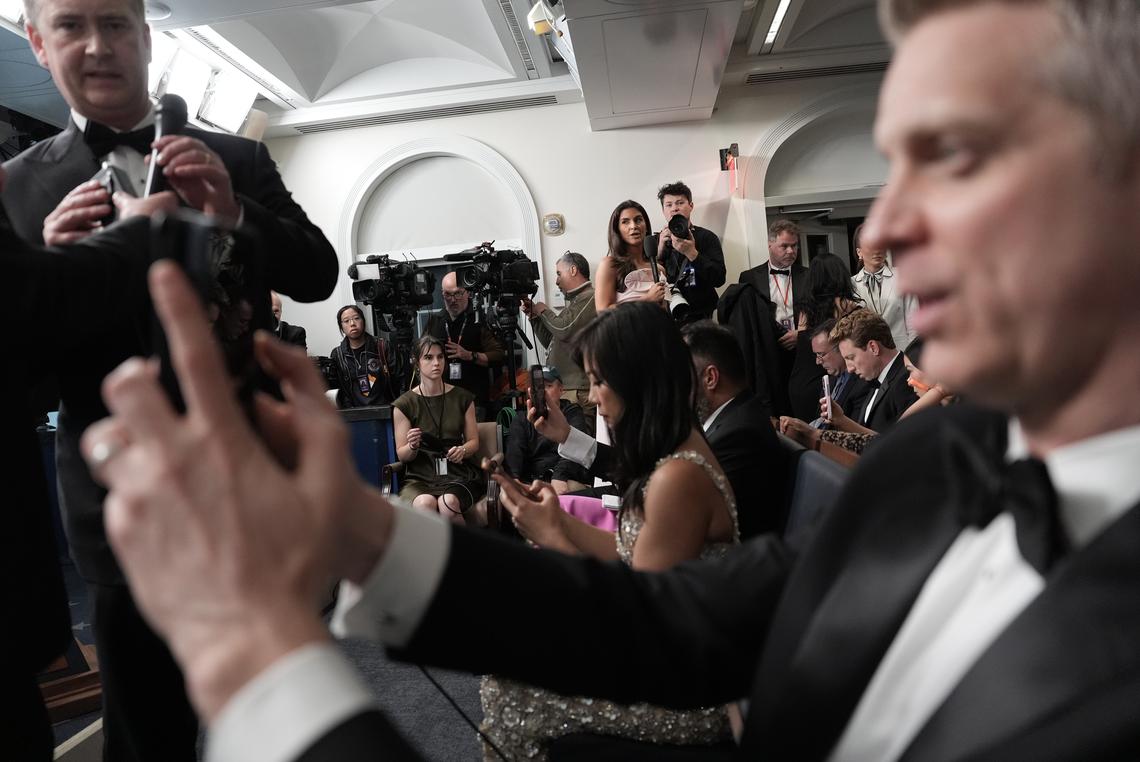 Reporters, many in formal wear, await the start of a briefing at the White House after shots were fired during the White House Correspondents' Association dinner in Washington on Saturday, April 25, 2026. President Donald Trump was rushed from the stage but appeared to be unharmed. (Salwan Georges/The New York Times)