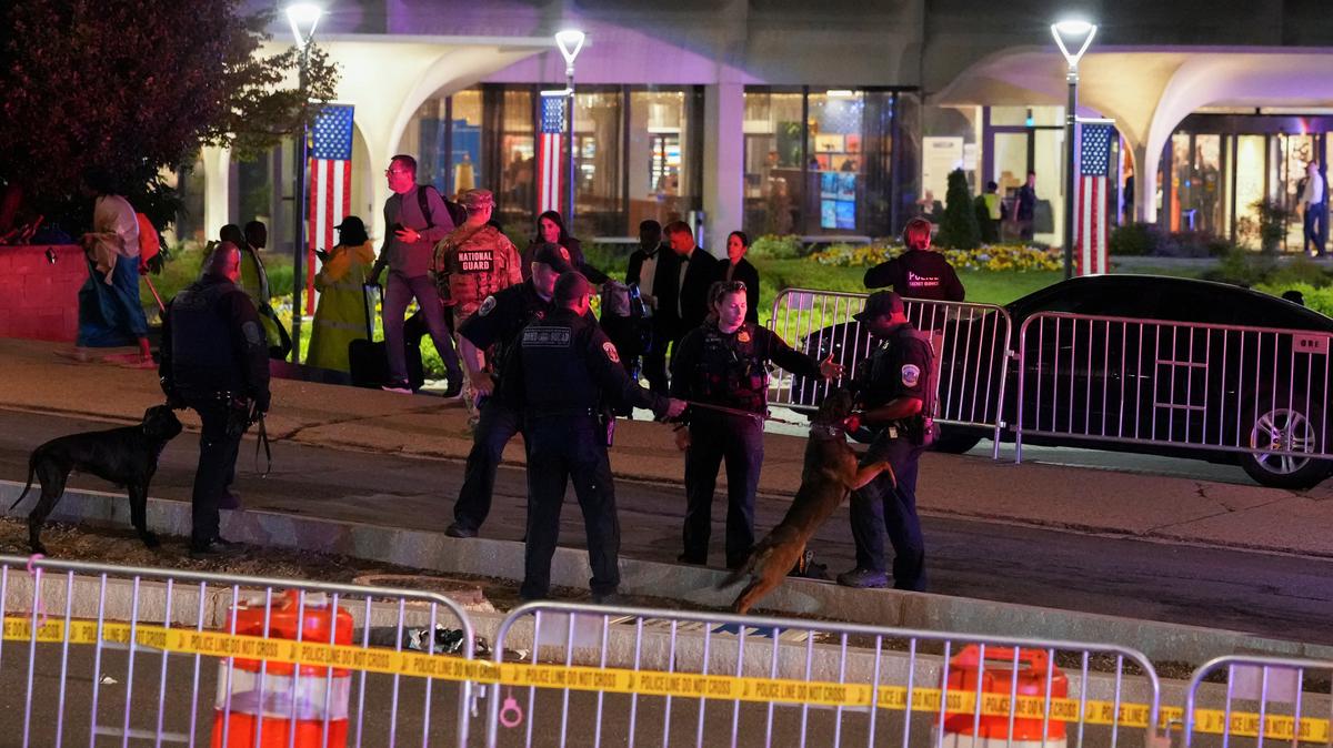 Police K-9 Unit officers stand with other law enforcement personnel at the venue following a shooting incident during the annual White House Correspondents' Association dinner, in Washington, D.C., U.S., April 25, 2026. REUTERS/Ken Cedeno/File Photo