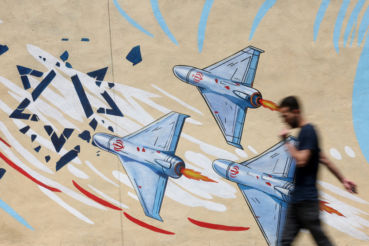 An Iranian man walks next to an anti-Israeli mural on a street in Tehran, Iran June 6, 2026. Majid Asgaripour/WANA (West Asia News Agency) via REUTERS