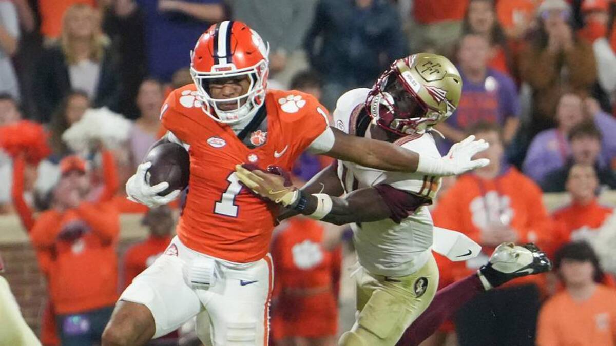  Nov 8, 2025; Clemson, South Carolina, USA; Florida State Seminoles defensive back Ja'Bril Rawls (11) tackles Clemson Tigers wide receiver T.J. Moore (1) during the second quarter at Memorial Stadium. Mandatory Credit: Ken Ruinard - GREENVILLE NEWS-USA TODAY Network via Imagn Images | Ken Ruinard - GREENVILLE NEWS-USA TODAY Network via Imagn Images 