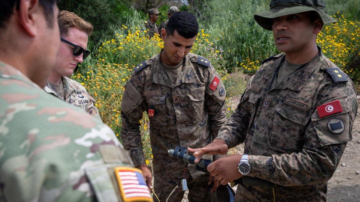 Members of the U.S. Army and Tunisian Armed Forces discuss training objectives during explosive ordnance disposal squad tactics exercises in Bizerte, Tunisia, during African Lion 2026. Two soldiers were reported missing on Saturday night in an incident unrelated to the military exercise. Photo by Staff Sgt. Cameron Christensen/U.S. Army