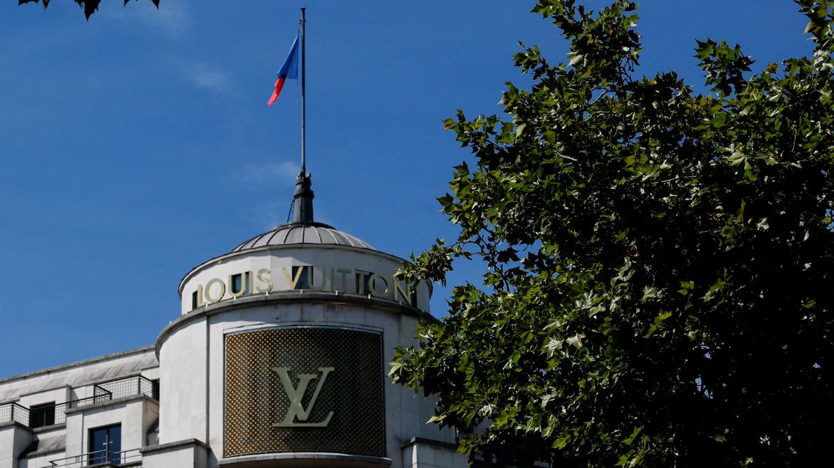 A Louis Vuitton logo is seen outside a store on the Champs-Elysees avenue in Paris, France, August 3, 2025. REUTERS/Stephanie Lecocq