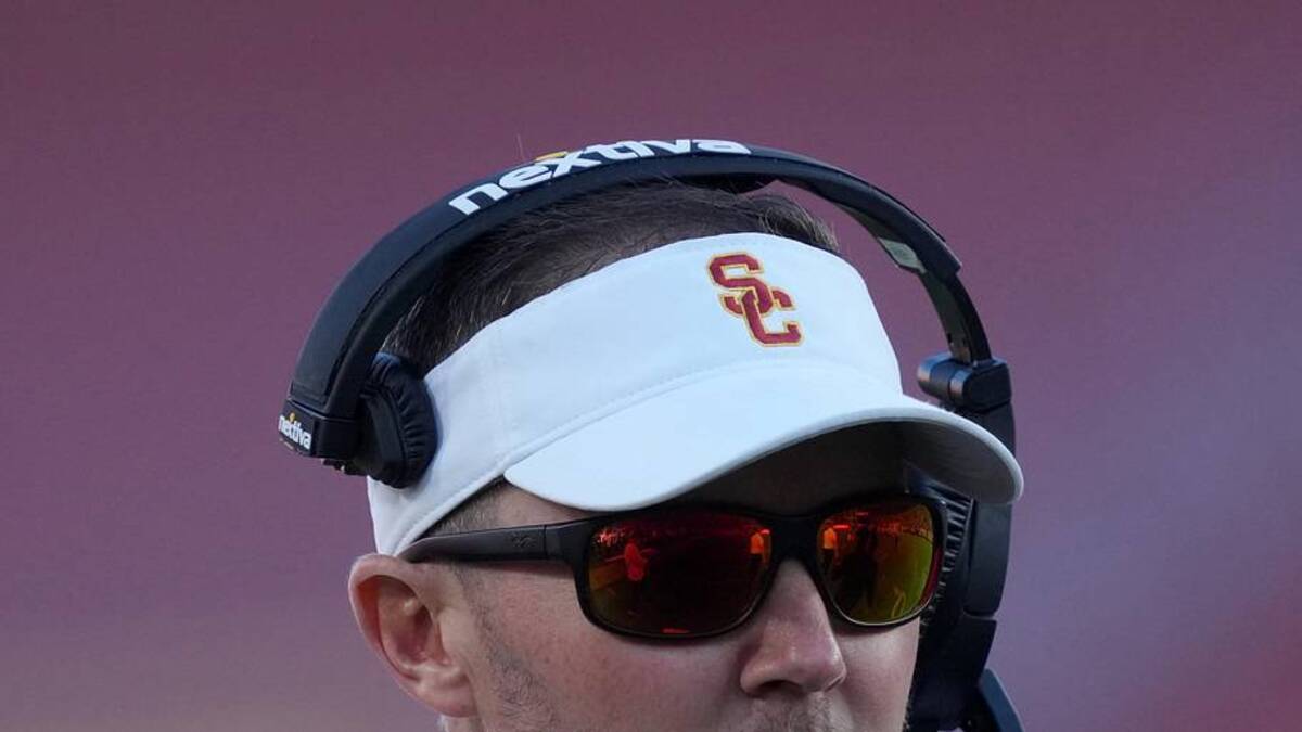  Oct 21, 2023; Los Angeles, California, USA; Southern California Trojans head coach Lincoln Riley watches from the sidelines against the Utah Utes in the first half at United Airlines Field at Los Angeles Memorial Coliseum. Mandatory Credit: Kirby Lee-Imagn Images | Kirby Lee-Imagn Images 