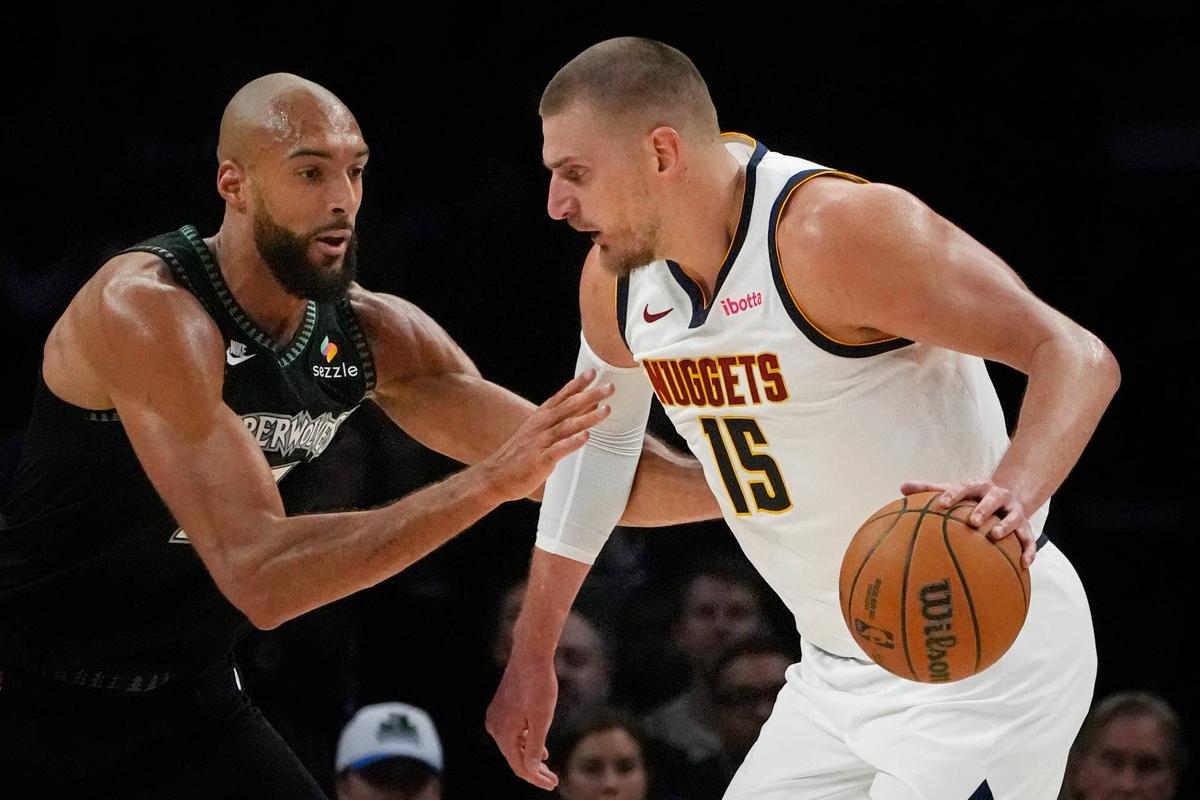  Denver Nuggets center Nikola Jokic (15) works around Minnesota Timberwolves center Rudy Gobert (27). Bruce Kluckhohn-Imagn Images