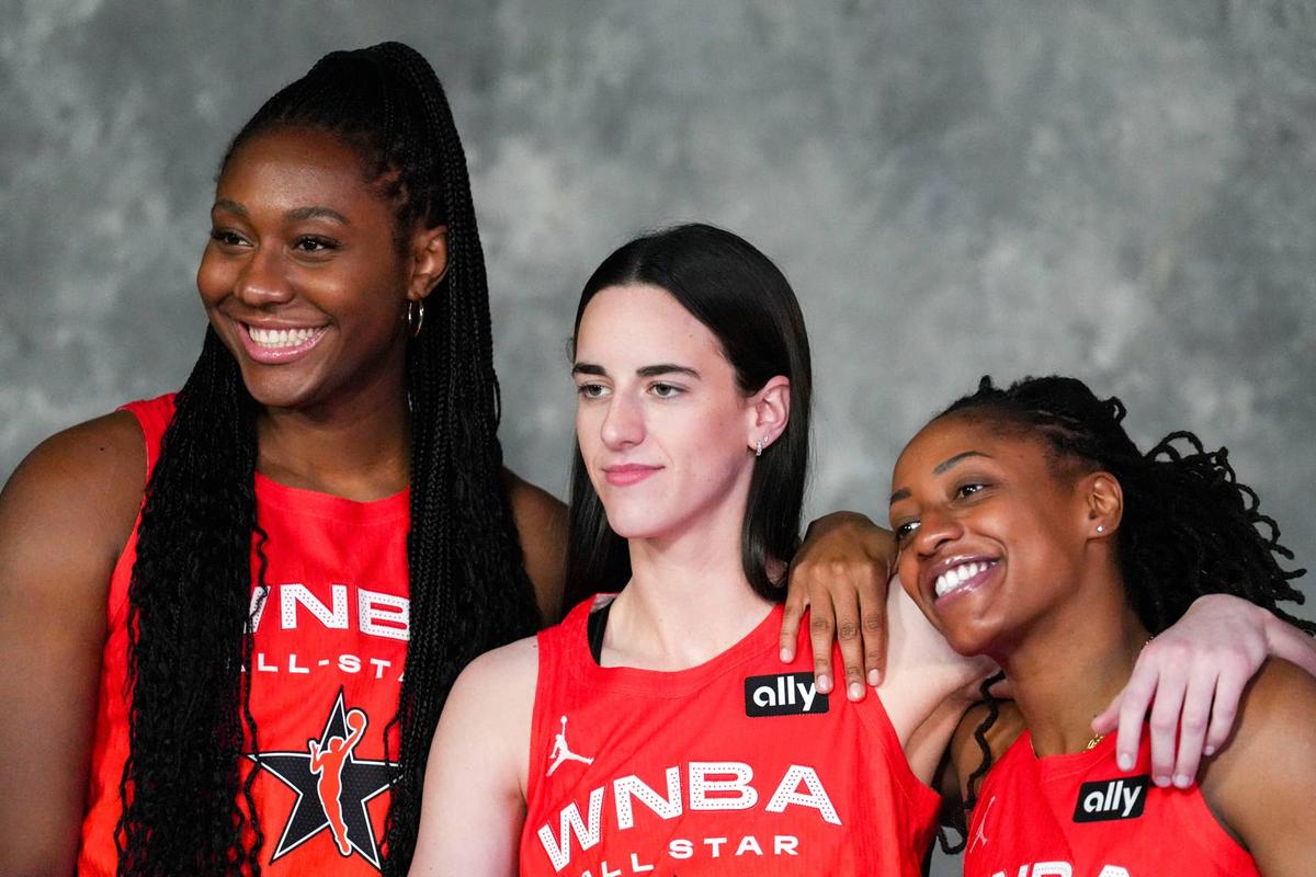  Indiana Fever's Aliyah Boston (7), Caitlin Clark (22) and Kelsey Mitchell (0) take a phot before the 2025 WNBA All-Star Game.