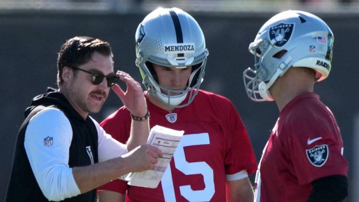  Jun 9, 2026; Henderson, NV, USA; Las Vegas Raiders offensive coordinator Andrew Janocko (left) talks with quarterbacks Fernando Mendoza (15) and Kirk Cousins (8) during minicamp at Intermountain Health Performance Center. Mandatory Credit: Kirby Lee-Imagn Images | Kirby Lee-Imagn Images 