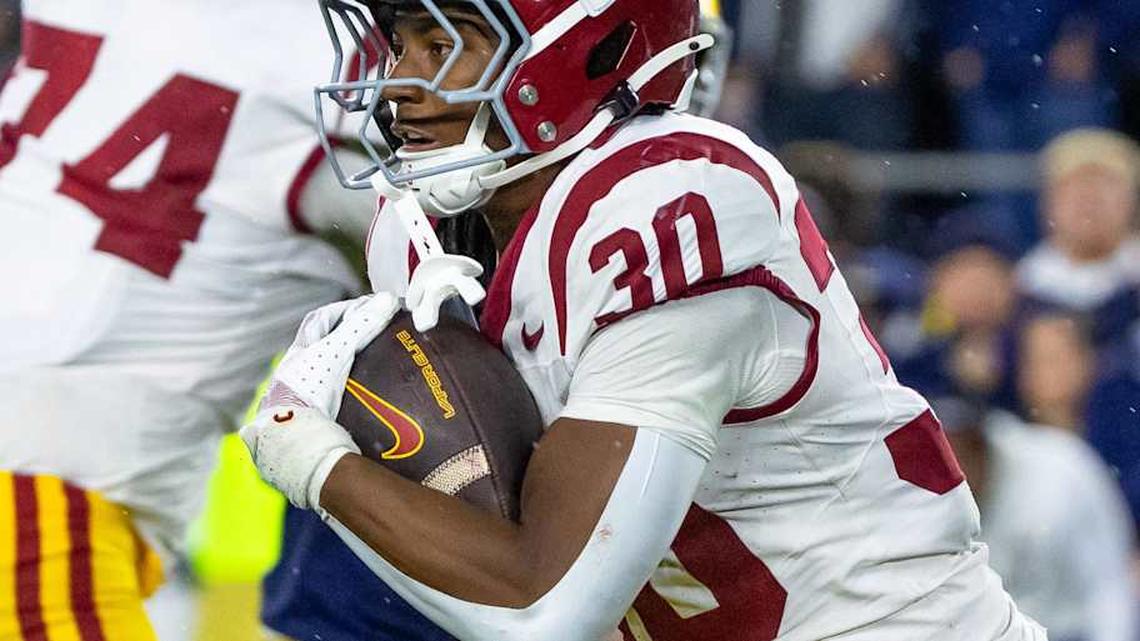  Oct 18, 2025; South Bend, Indiana, USA; Southern California Trojans running back King Miller (30) runs the ball against the Notre Dame Fighting Irish during the first half at Notre Dame Stadium. Mandatory Credit: Michael Caterina-Imagn Images | Michael Caterina-Imagn Images 