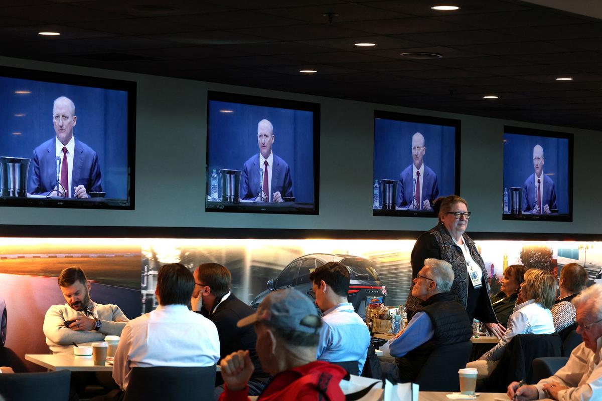 Shareholders watch screens as Berkshire Hathaway CEO Greg Abel addresses the Berkshire Hathaway Inc’s annual shareholders meeting, the conglomerate’s first since Warren Buffett stepped down after 60 years as chief executive and was succeeded by Abel, in Omaha, Nebraska, U.S., May 2, 2026. REUTERS/Brendan McDermid