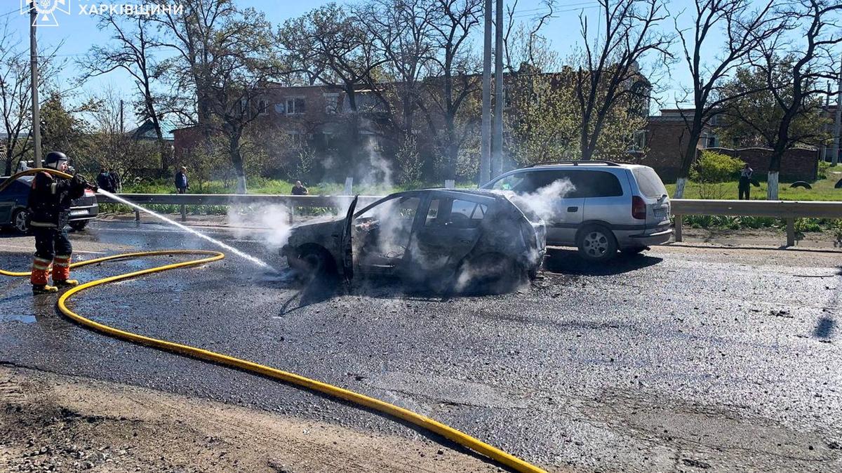 A firefighter extinguishes a car, which was damaged during a Russian missile strike in the town of Merefa, amid Russia's attack on Ukraine, in the Kharkiv region, Ukraine, May 4, 2026. Press service of the State Emergency Service of Ukraine in Kharkiv region/Handout via REUTERS