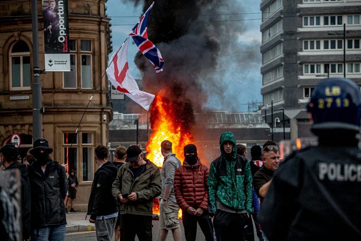  Far-right activists hold a rally in Sunderland, England, following the killing of three girls in Southport in July 2024 that set off rampant misinformation and rioting. Simone J Rudolphi/Drik/Getty Images 