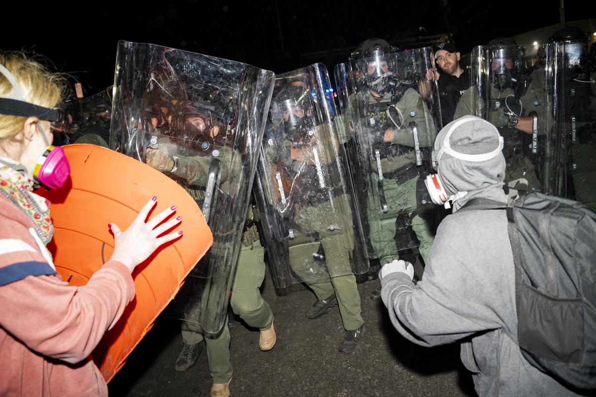 Demonstrators and police officers outside the Delaney Hall immigration detention center in Newark, N.J., May 30, 2026. Mayor Ras Baraka of Newark imposed a curfew early Sunday around the immigration detention center after a second consecutive night of unrest over living conditions there. (Vincent Alban/The New York Times)