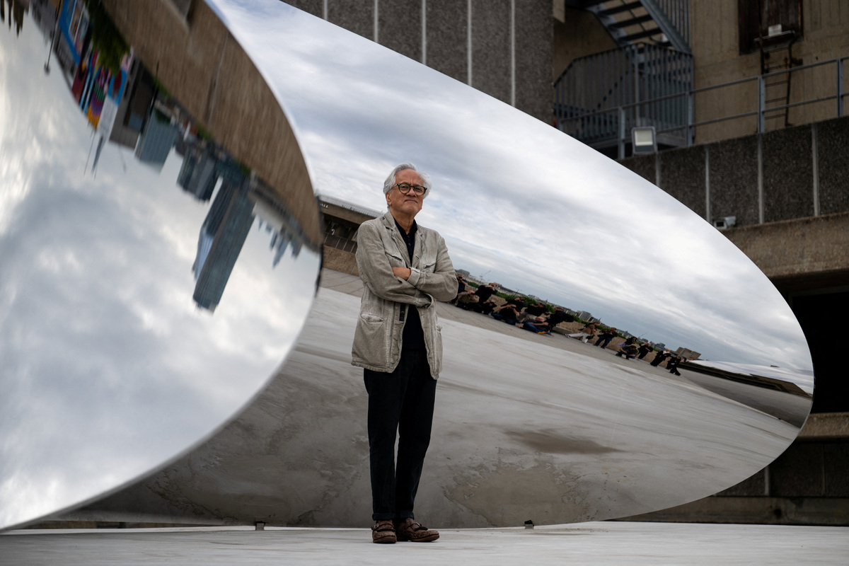 British-Indian sculptor Anish Kapoor poses for a photograph next to his installation 'Tsunami' (2025) during the press view for 'Anish Kapoor' at the Hayward Gallery, in London, Britain, June 15, 2026. REUTERS/Chris J. Ratcliffe
