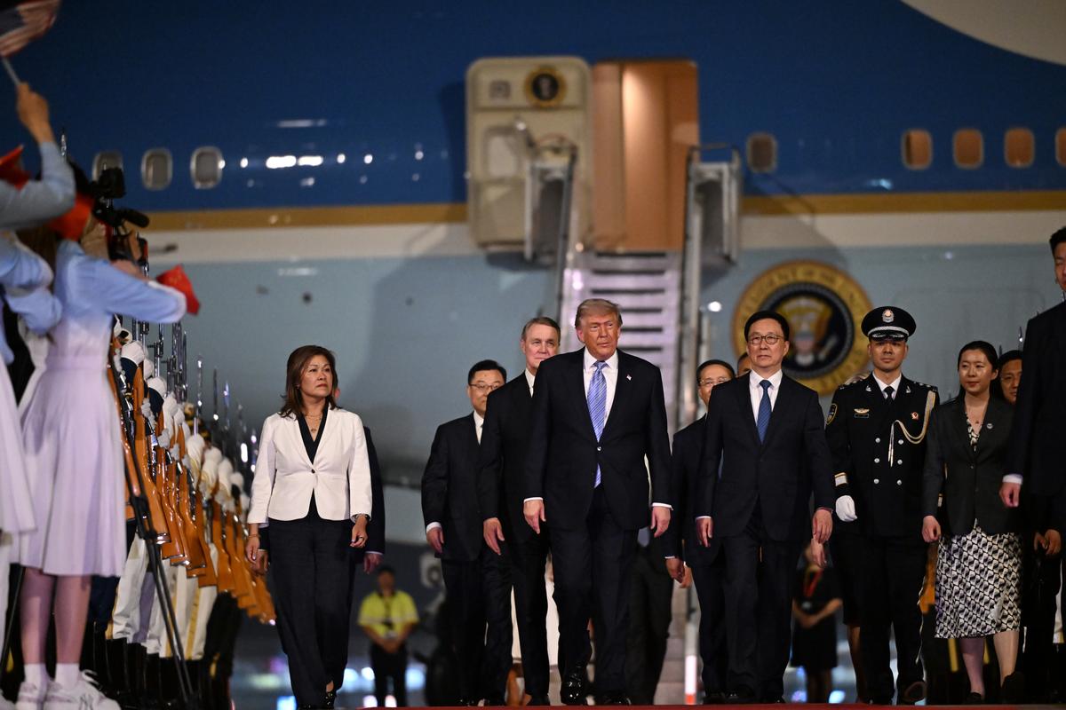 President Donald Trump, center, arrives at Beijing Capital International Airport in Beijing, China, on Wednesday, May 13, 2026, for a two-day summit with China's leader, Xi Jinping. (Kenny Holston/The New York Times)