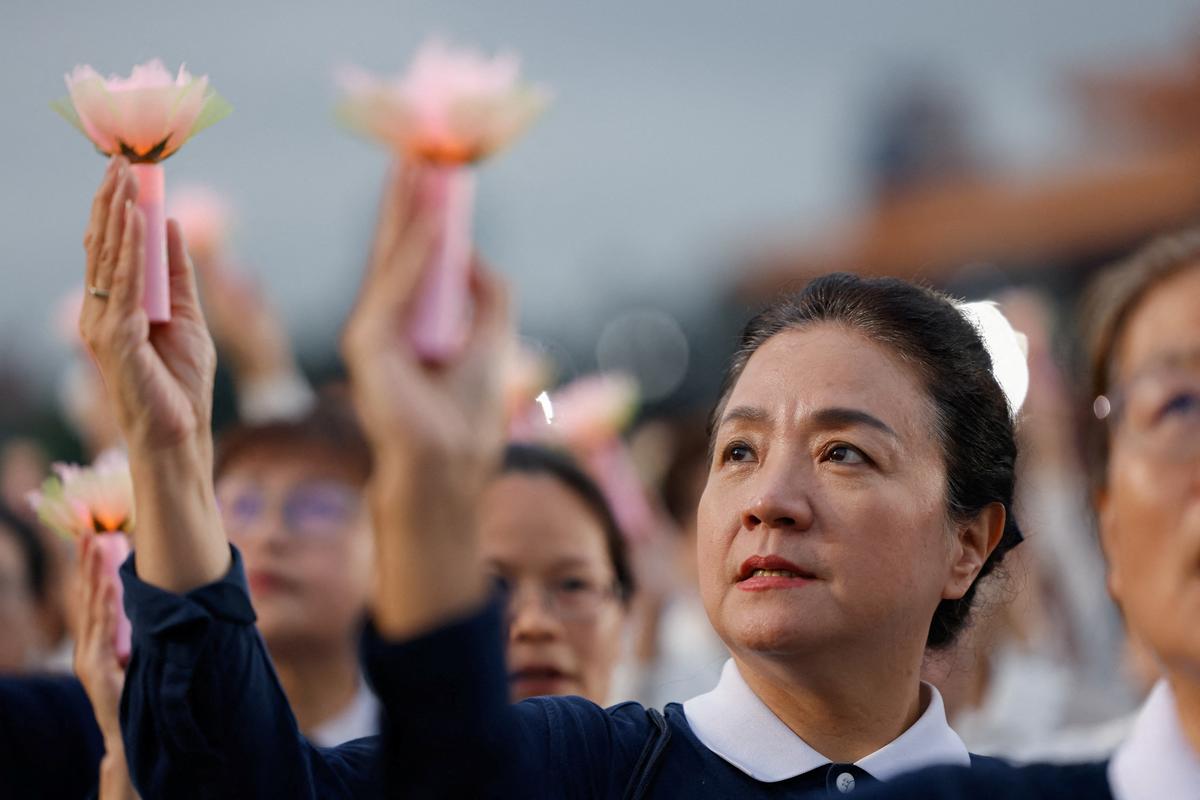 Buddhist Tzu Chi Foundation members commemorate the organization’s 60th anniversary during an annual Buddha bathing ceremony marking Buddha’s birthday, Mother’s Day and Global Tzu Chi Day at Chiang Kai-shek Memorial Hall in Taipei, Taiwan, May 10, 2026. REUTERS/Ann Wang