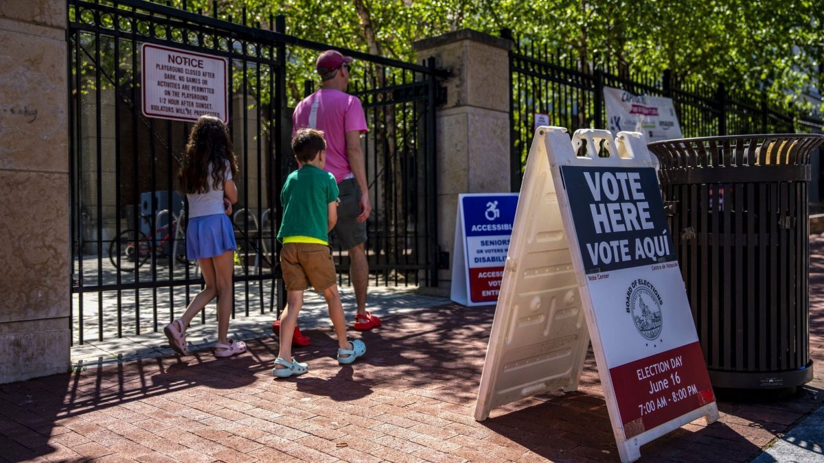 People arrive to vote in Washington, D.C.'s, 2026 primary elections at Stuart Hobson Middle School on Tuesday. The two front-runners to succeed Mayor Muriel Bowser are Kenyan McDuffie and Janeese Lewis George. Photo by Bonnie Cash/UPI