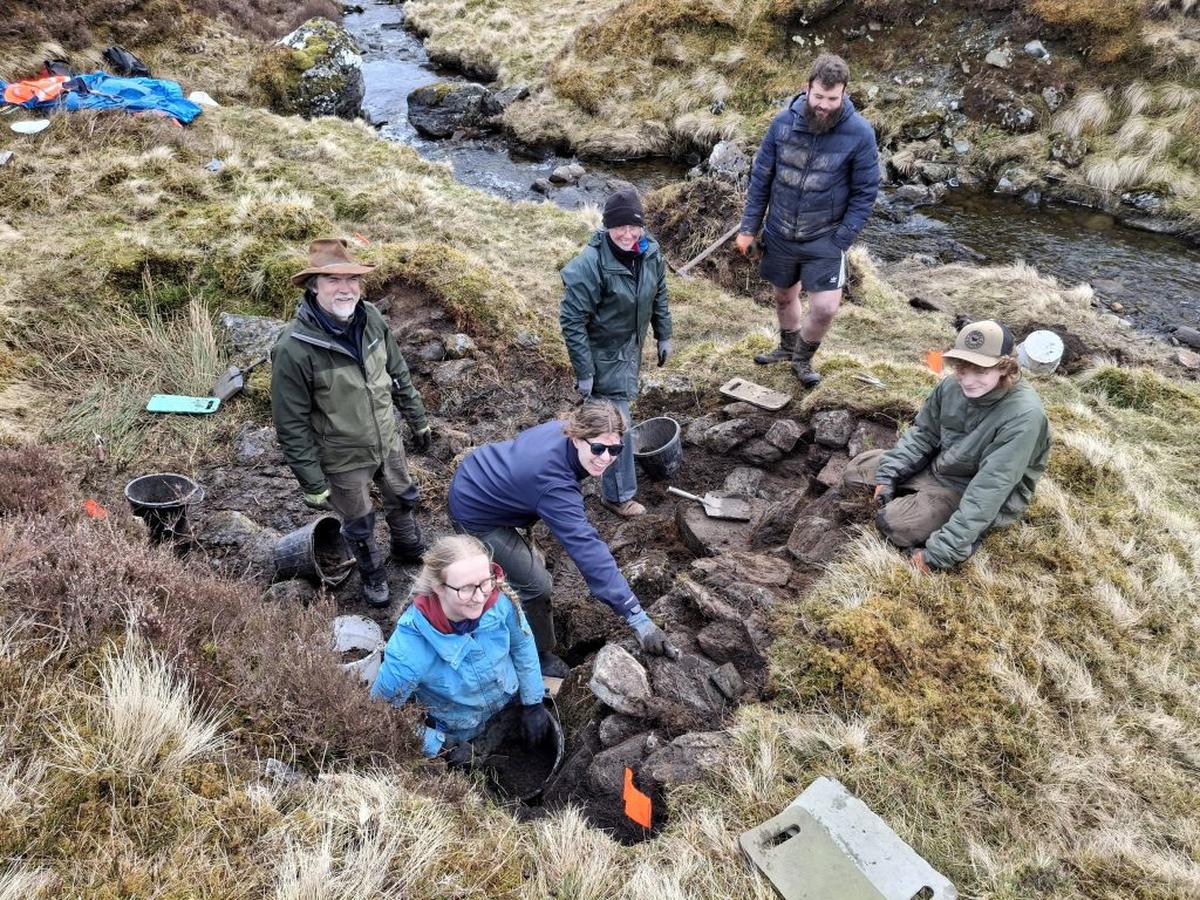 National Trust for Scotland Achaeology team and volunteers at the whisky still site. (National Trust for Scotland via SWNS) 