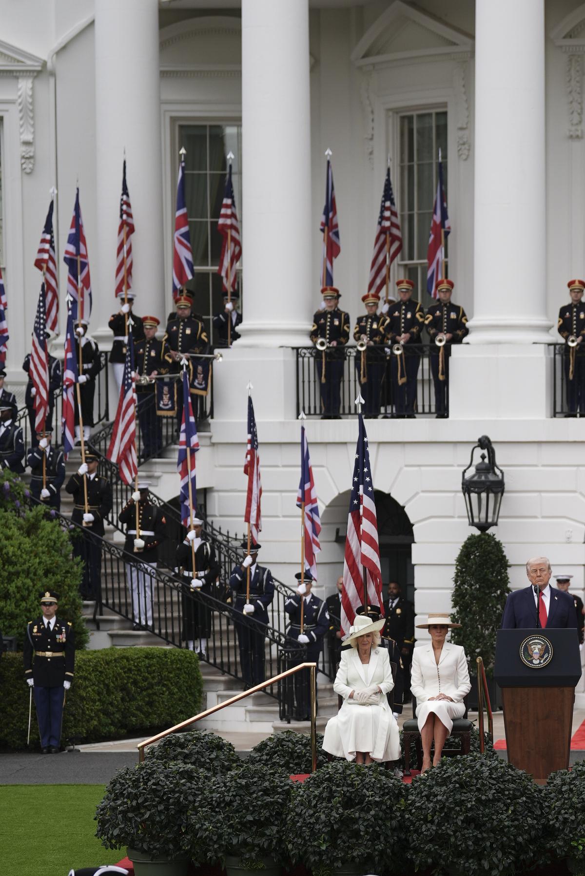 Members of the U.S. Army Old Guard Fife and Drum Corps perform in front of, from right, King Charles III, President Donald Trump, first lady Melania Trump and Queen Camilla during an arrival ceremony on the South Lawn of the White House in Washington, on Tuesday, April 28, 2026. (Salwan Georges/The New York Times)
