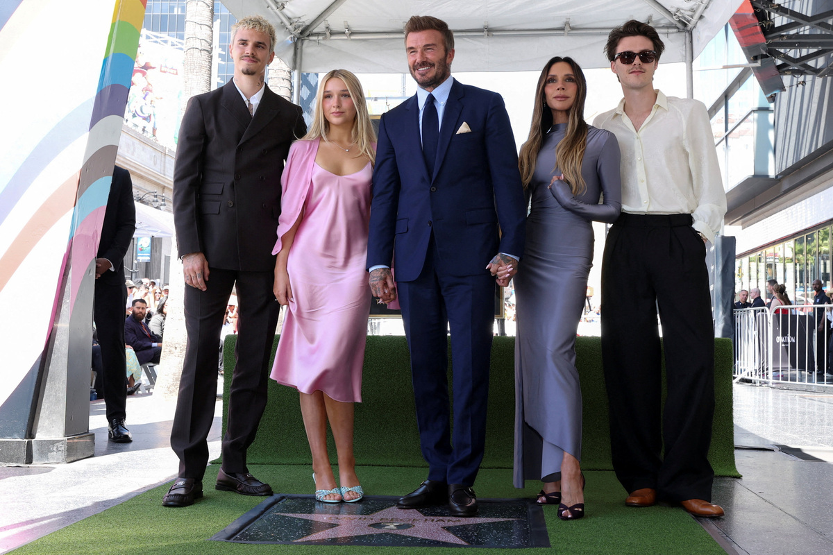 David Beckham poses with his wife Victoria Beckham, his daughter Harper Beckham and his sons Cruz Beckham and Romeo Beckham during his star unveiling ceremony on the Hollywood Walk of Fame, in Los Angeles, California, U.S., June 12, 2026. REUTERS/Mario Anzuoni