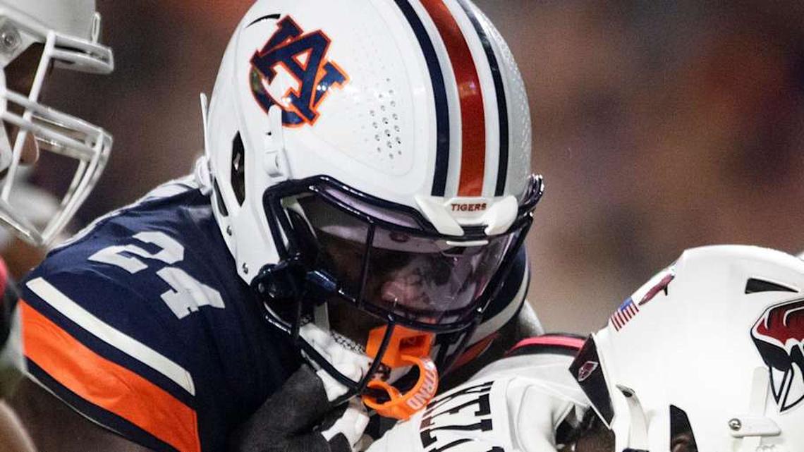  Auburn Tigers buck Keyron Crawford (24) sacks Ball State Cardinals quarterback Kiael Kelly (1) as Auburn Tigers take on Ball State Cardinals at Jordan-Hare Stadium in Auburn, Ala. on Saturday, Sept. 6, 2025. Auburn Tigers lead Ball State Cardinals 21-0 at halftime. | Jake Crandall/ Advertiser / USA TODAY NETWORK via Imagn Images 