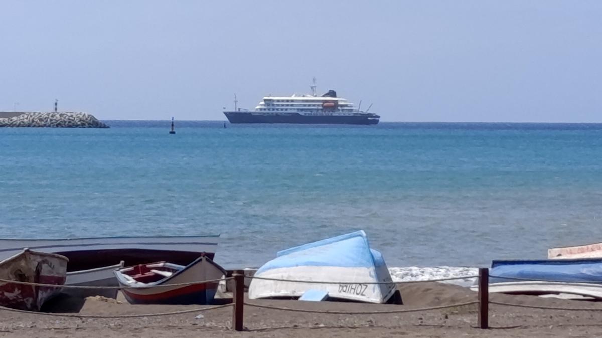 Cruise ship MV Hondius docks off Cape Verde port, as passengers were not allowed off the ship, while health authorities investigated suspected cases of hantavirus aboard the vessel, in Praia Port, Cape Verde, May 4, 2026. REUTERS/Stringer