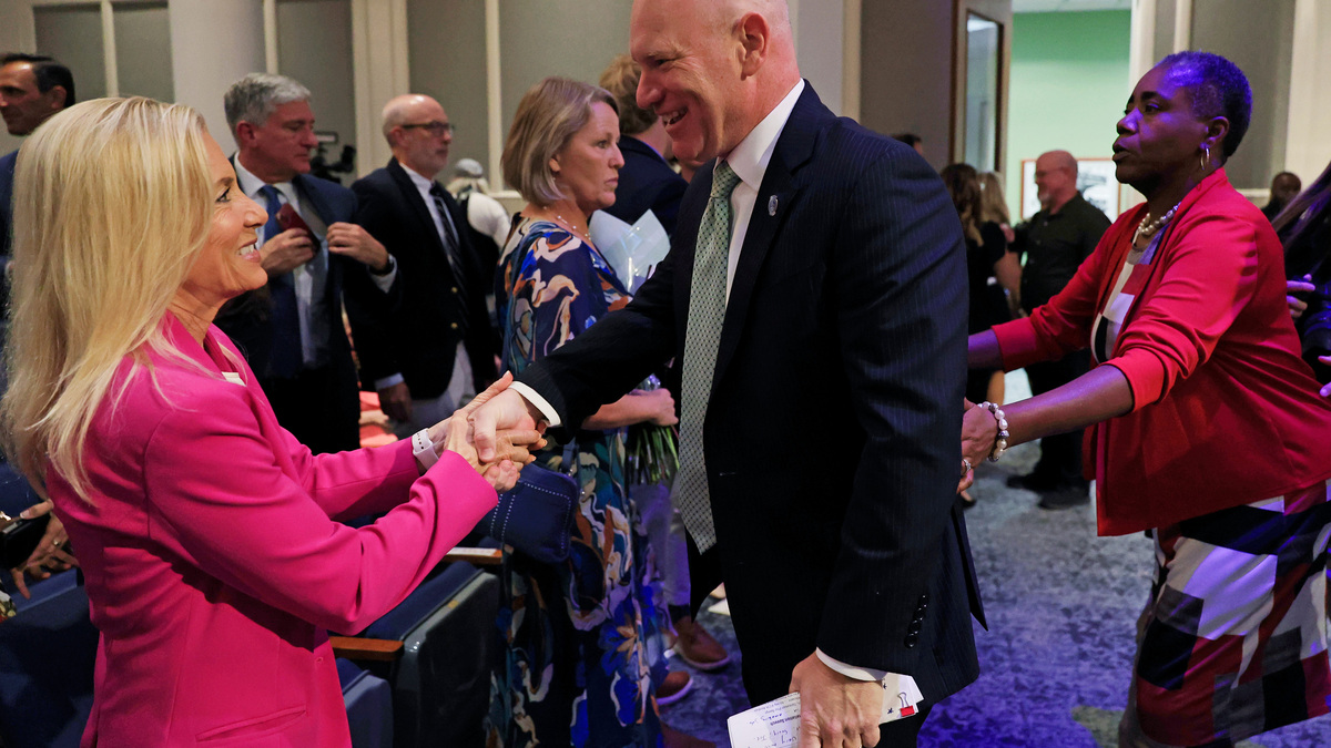 Newly sworn in City Council President Nick Howland is greeted by Mayor Donna Deegan during an installation ceremony of City Council leadership, Thursday, June 25, 2026, in Jacksonville, Fla. Council members Nick Howland was sworn in as City Council President and Joe Carlucci as Vice President. Their one-year terms begin July 1.