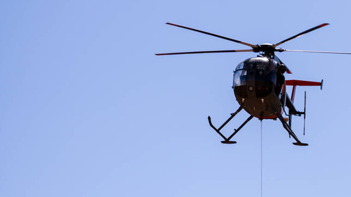 A helicopter carries bighorn sheep captured for relocation on Monday, June 29, 2026, in Valley of Fire State Park in. Nevada. (Marley Barboeisel/Las Vegas Review-Journal/TNS)
