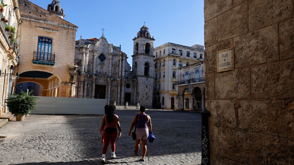 Women walk through Cathedral Square, one of the most popular tourist spots in Old Havana, as U.S. sanctions have led most major tourism and travel companies to leave the island or drastically scale back their operations, in Havana, Cuba June 8, 2026. REUTERS/Norlys Perez