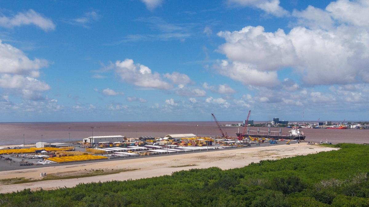 A drone view shows the Vreed en Hoop Shorebase Inc facility, part of Guyana's oil and gas infrastructure, in Vreed en Hoop on May 9. The country's fast-growing economy is set to benefit from a reshaped global energy market due to the U.S.-Israeli war on Iran.