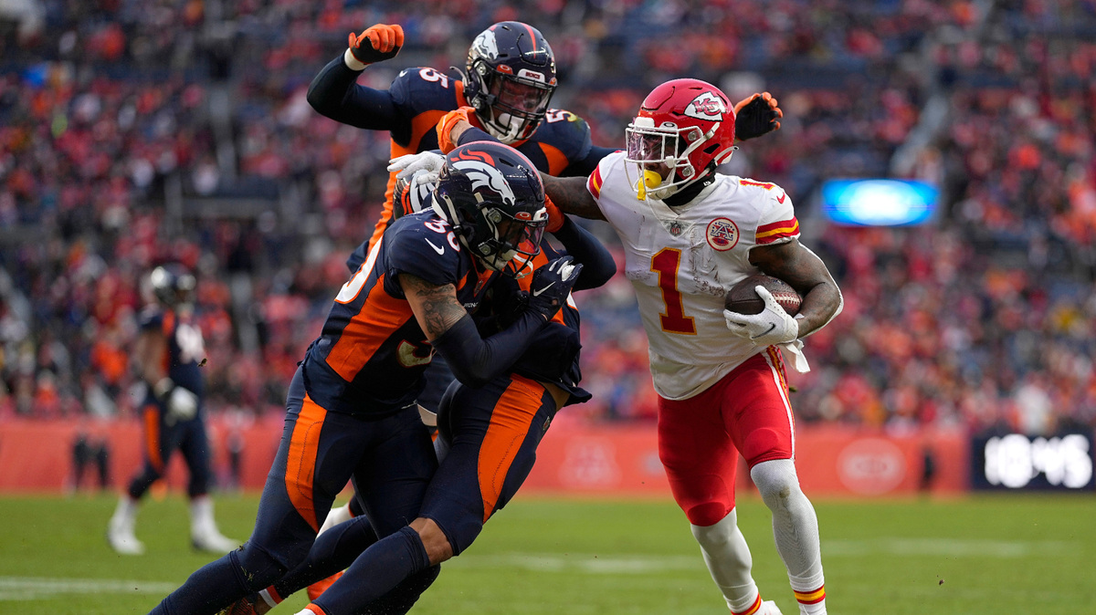 Kansas City Chiefs running back Jerick McKinnon (1) runs toward the end zone to score against Denver Broncos safety Caden Sterns, left, cornerback Bryce Callahan, bottom middle, and outside linebacker Bradley Chubb, rear, during the second half of an NFL football game Saturday, Jan. 8, 2022, in Denver. (AP Photo/Jack Dempsey)