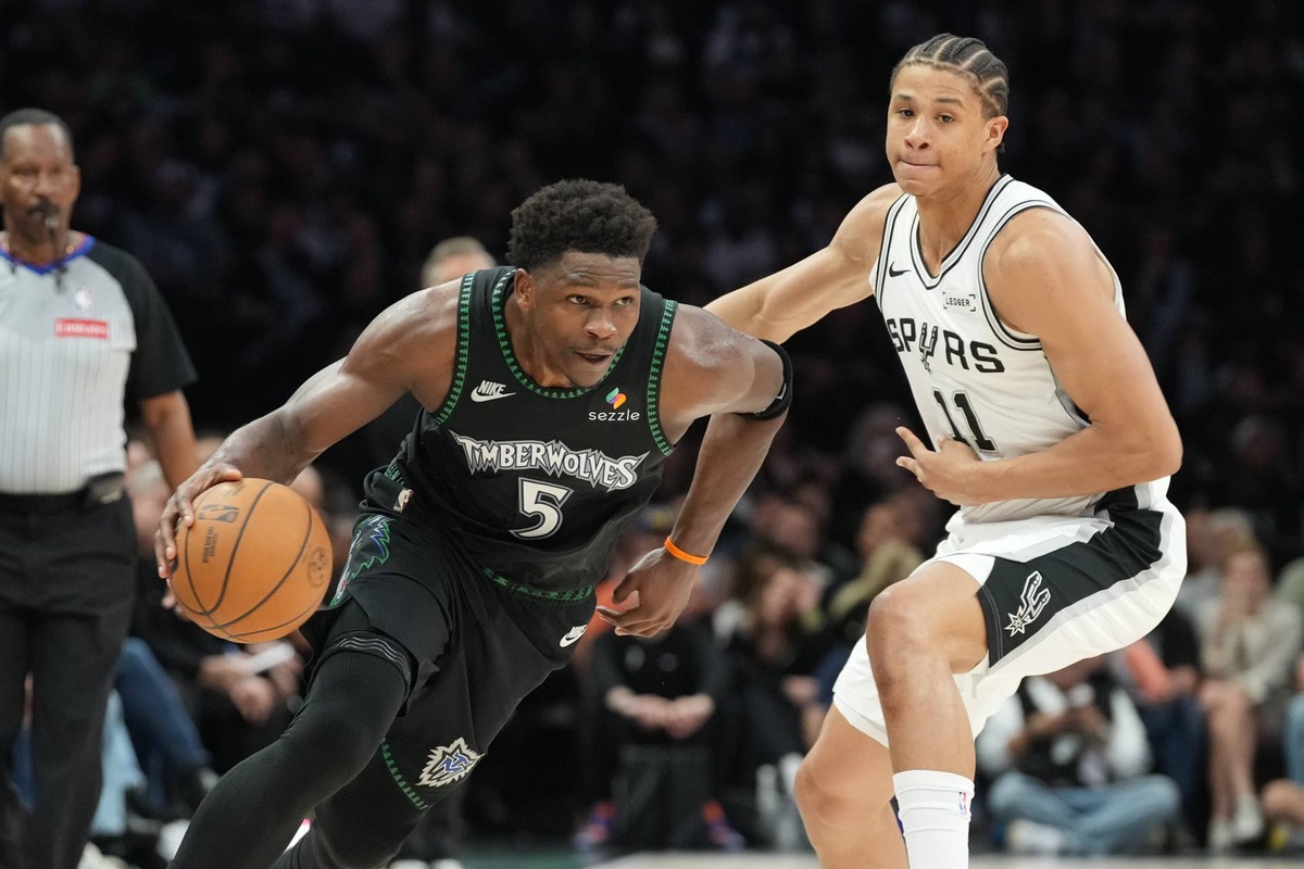  Minnesota Timberwolves guard Anthony Edwards dribbles the ball past San Antonio Spurs forward Carter Bryant in the 2026 NBA playoffs. Jesse Johnson-Imagn Images