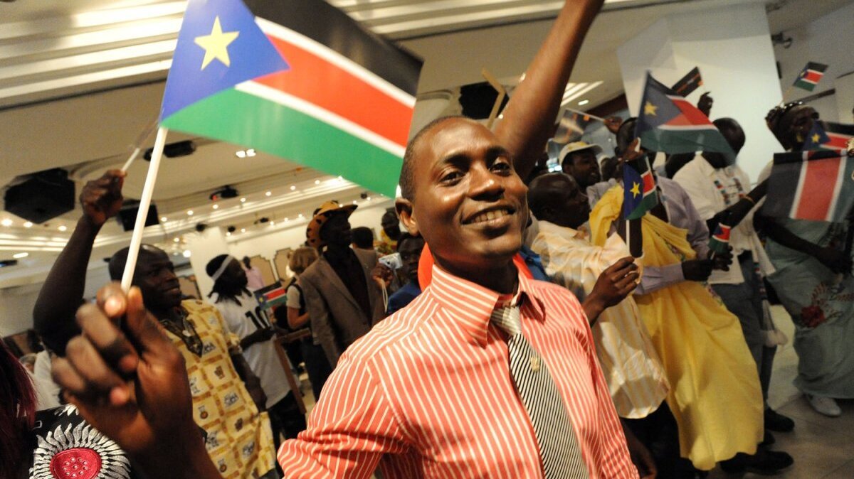 A Southern Sudanese refugee waves a South Sudan flag during independence celebrations in Tel Aviv, Israel, July 10, 2011. Israeli Prime Minister Benjamin Netanyahu announced Sunday that Israel would recognize South Sudan after it declared itself an independent state. File Photo by Debbie Hill/UPI