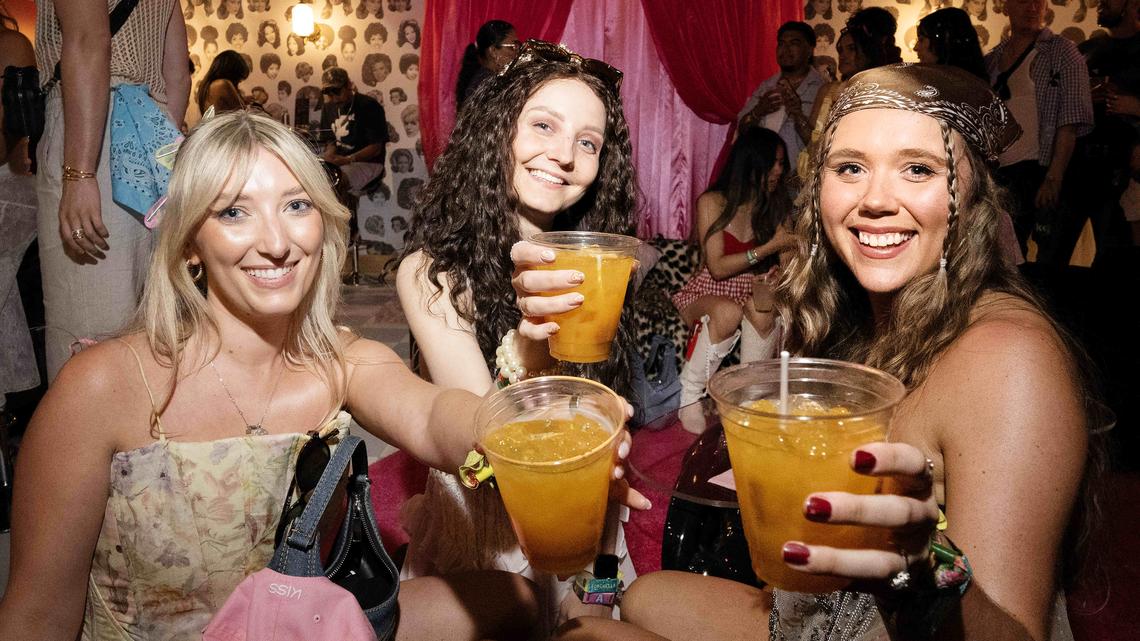 From left, Katie Hardwick, Rachel Fitzpatrick and Clare Crossley pose for a photograph inside Sabrina Carpenter’s Pretty Girl Parlor during day one of the Coachella Valley Music & Arts Festival in Indio on Friday, April 17, 2026. (Photo by Drew A. Kelley, Press-Telegram/SCNG)
