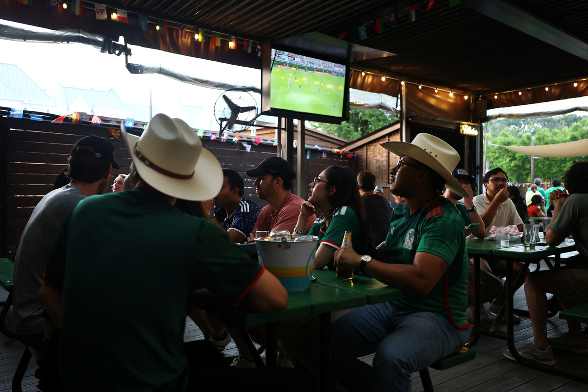 People watch a 2026 FIFA World Cup match between Mexico and South Korea, in Houston, Texas, U.S., June 18, 2026. REUTERS/Pedro Nunes