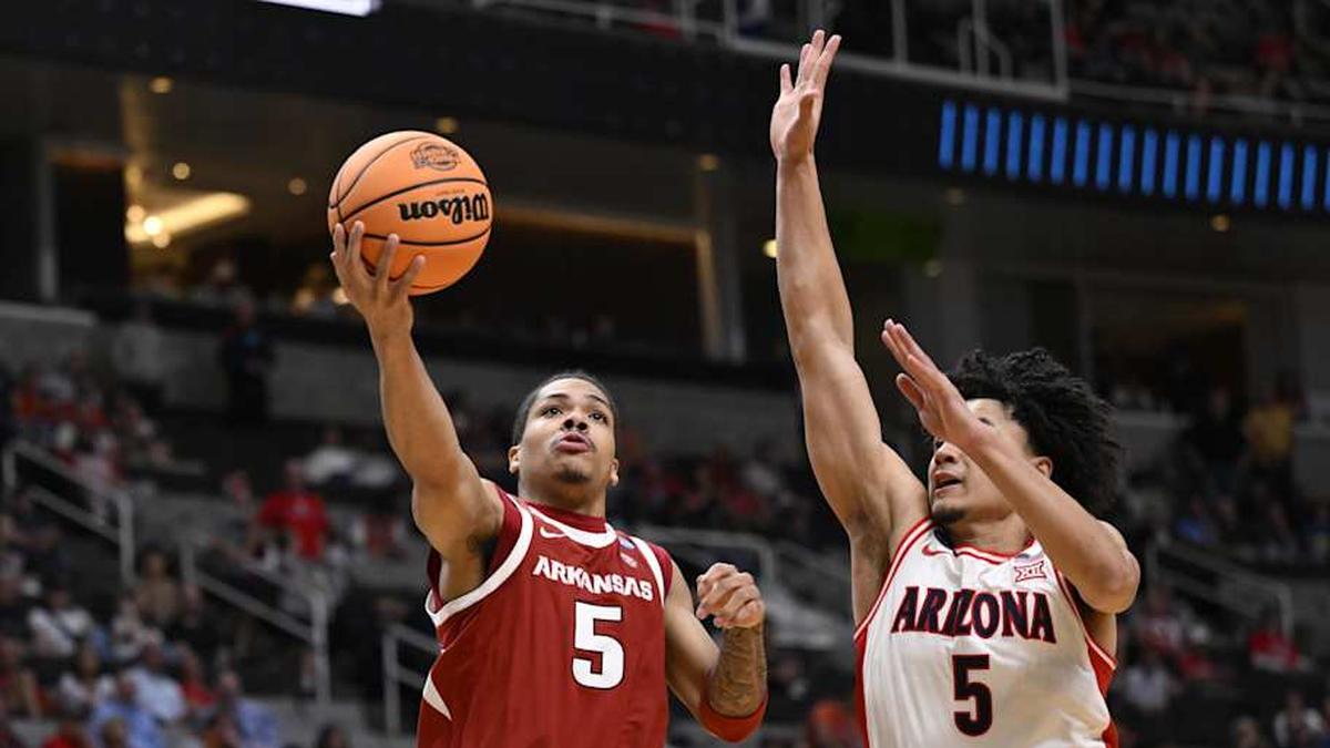  Mar 26, 2026; San Jose, CA, USA; Arkansas Razorbacks guard Darius Acuff Jr. (5) shoots past Arizona Wildcats guard Brayden Burries (5) in the second half during a Sweet Sixteen game of the West Regional of the men's 2026 NCAA Tournament at SAP Center. Mandatory Credit: Eakin Howard-Imagn Images | Eakin Howard-Imagn Images 