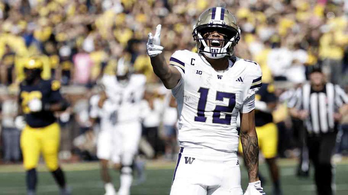  Oct 18, 2025; Ann Arbor, Michigan, USA; Washington Huskies wide receiver Denzel Boston (12) celebrates after he makes a reception in the first half against the Michigan Wolverines at Michigan Stadium. Mandatory Credit: Rick Osentoski-Imagn Images | Rick Osentoski-Imagn Images 