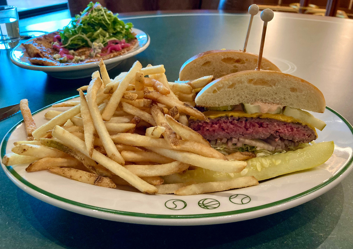 The Tavern Burger at Sports & Rec features their tavern sauce, multiple pickles, lettuce and onion and is delicious. Make sure to ask for a side of their house made ranch dressing for the fries. You will not be sorry.