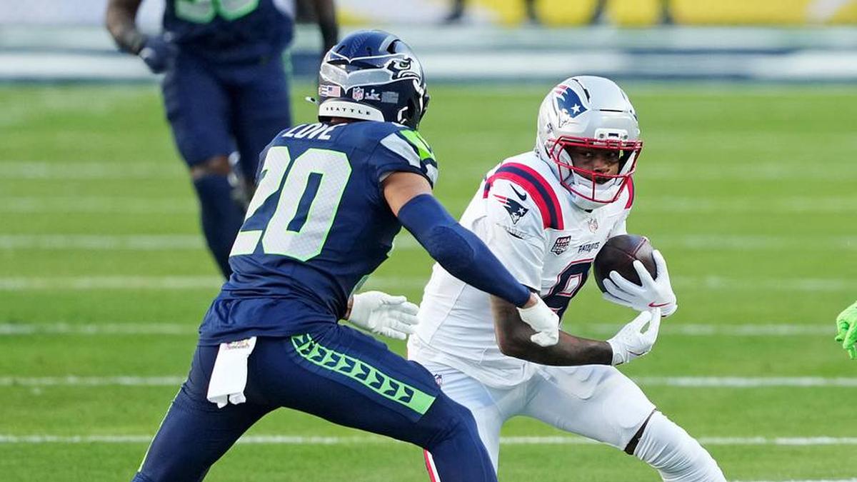  Feb 8, 2026; Santa Clara, CA, USA; New England Patriots wide receiver Kayshon Boutte (9) makes a catch against Seattle Seahawks safety Julian Love (20) during the first quarter in Super Bowl LX at Levi's Stadium. Mandatory Credit: Darren Yamashita-Imagn Images | Darren Yamashita-Imagn Images 