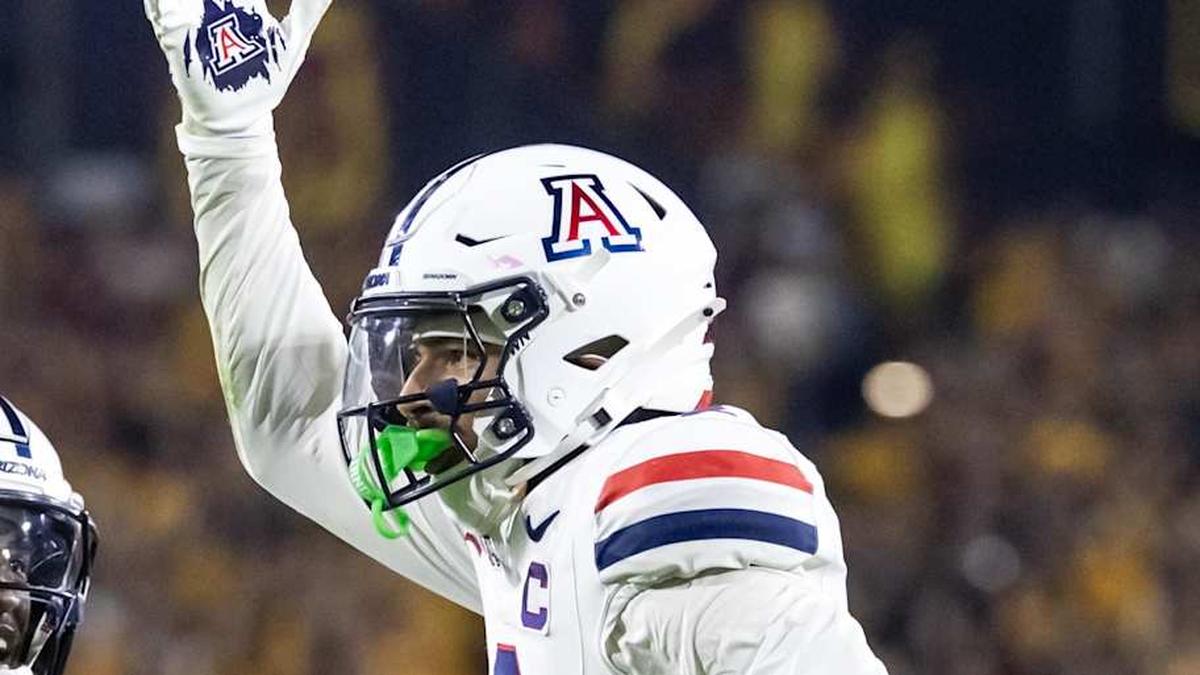  Nov 28, 2025; Tempe, Arizona, USA; Arizona Wildcats defensive back Treydan Stukes (2) celebrates with defensive back Ayden Garnes (9) after an interception against Arizona State Sun Devils in the second half during the 99th Territorial Cup at Mountain America Stadium. Mandatory Credit: Mark J. Rebilas-Imagn Images | Mark J. Rebilas-Imagn Images 