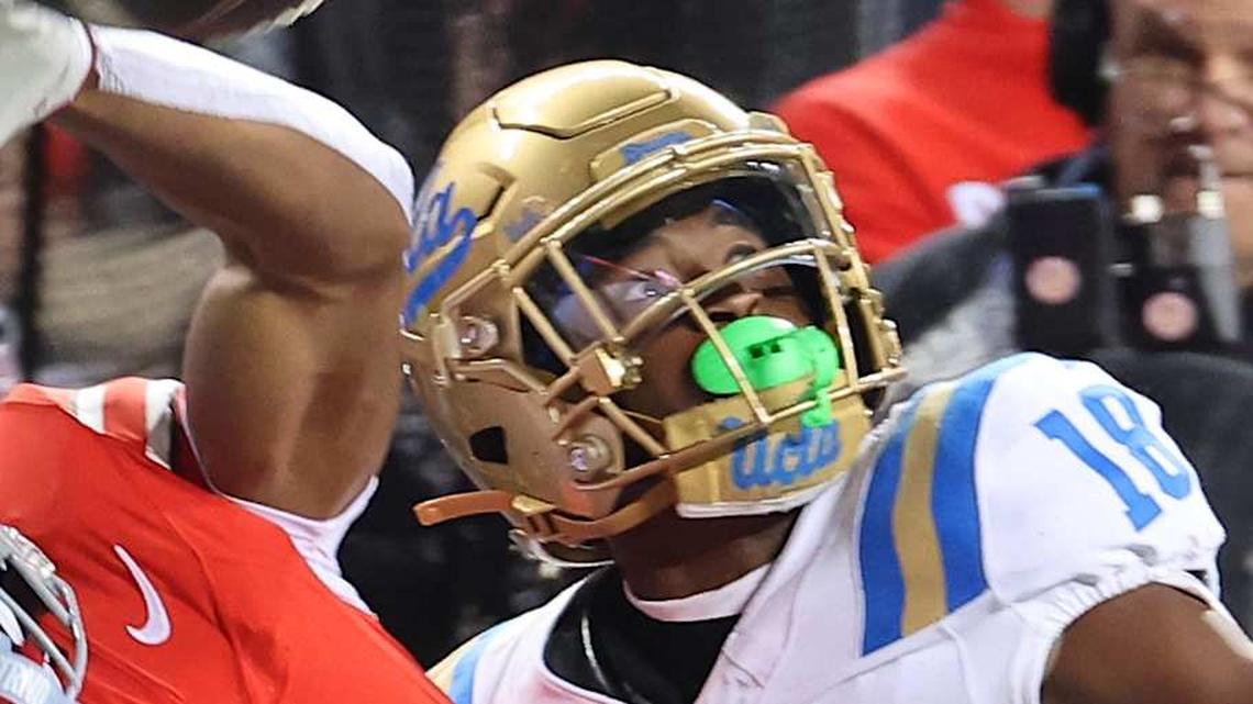  Nov 15, 2025; Columbus, Ohio, USA; Ohio State Buckeyes wide receiver Quincy Porter (11) attempts to catch the ball as UCLA Bruins defensive back Rodrick Pleasant (18) interferes on the play during the second quarter at Ohio Stadium. Mandatory Credit: Joseph Maiorana-Imagn Images | Joseph Maiorana-Imagn Images 