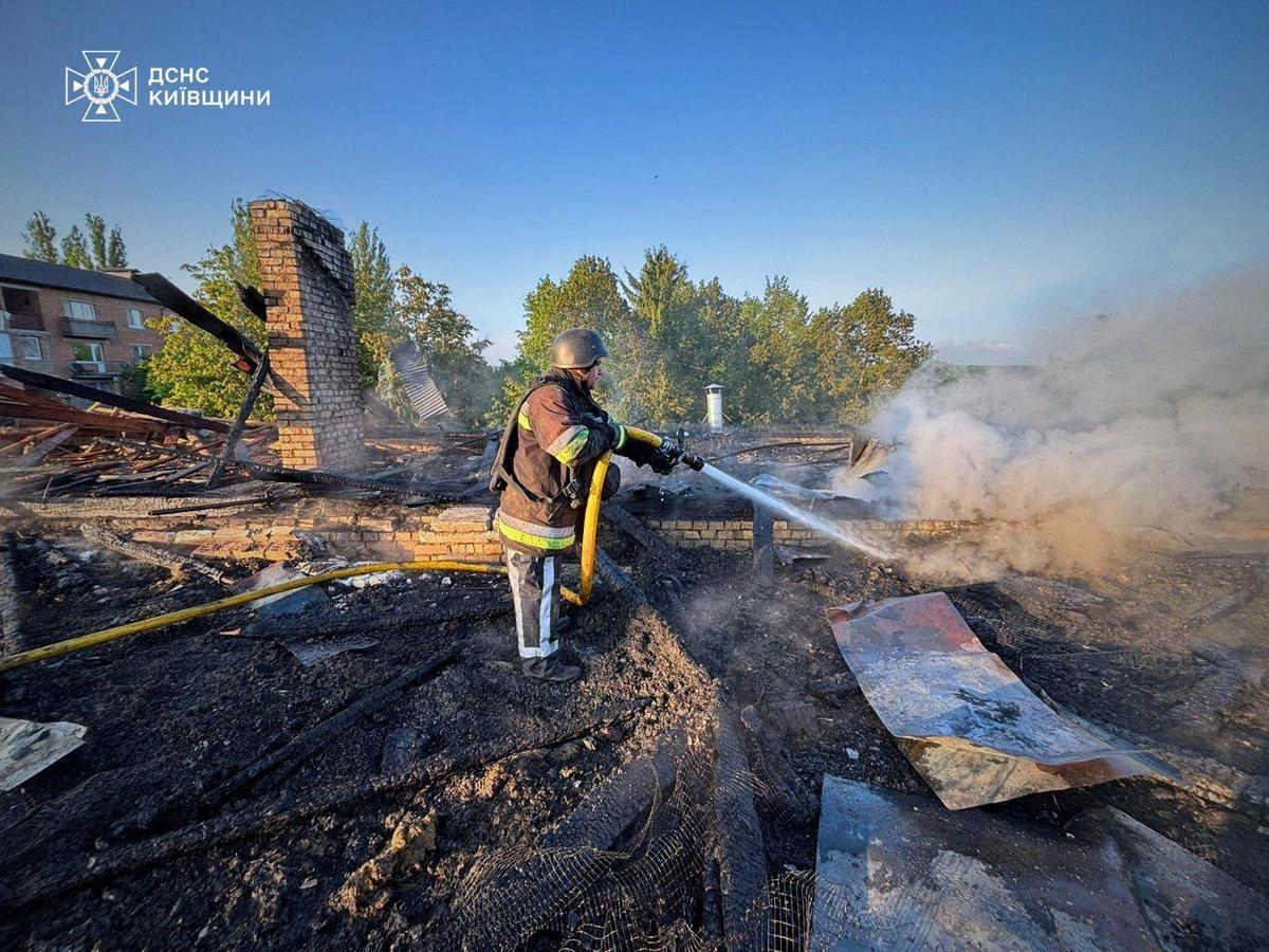 A firefighter works at the site of a kindergarten damaged during a Russian drone strike, amid Russia's attack on Ukraine, in Kyiv region, Ukraine May 12, 2026. Press service of the State Emergency Service of Ukraine in Kyiv region/Handout via REUTERS