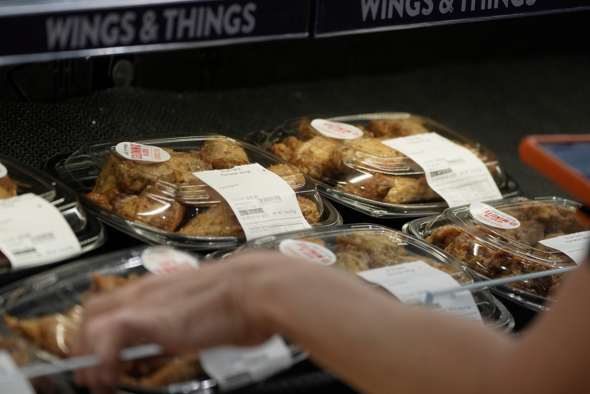 The expiration dates of the prepared food at the Wegmans in Penfield, is checked on Nov. 19, 2025.