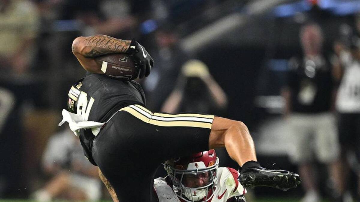  Sep 13, 2025; West Lafayette, Indiana, USA; Purdue Boilermakers wide receiver Michael Jackson III (2) is tackled by USC Trojans linebacker Desman Stephens II (23) during the second half at Ross-Ade Stadium. Mandatory Credit: Marc Lebryk-Imagn Images | Marc Lebryk-Imagn Images 